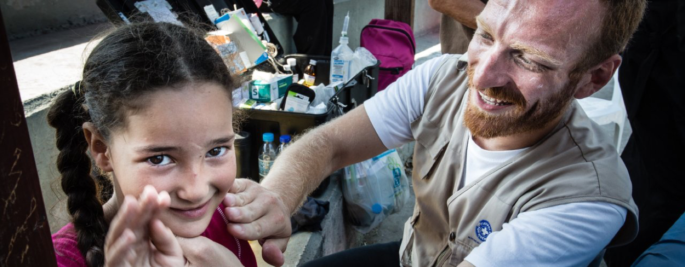 doctor-treating-refugee-girl-in-lesbos