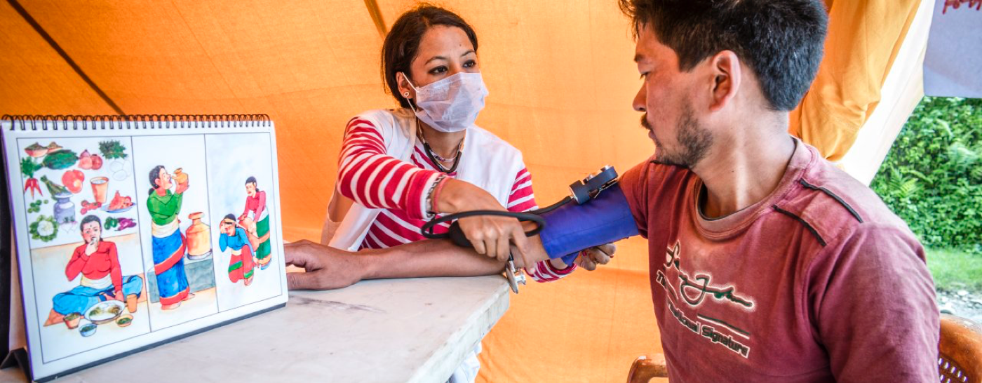 medic-taking-blood-pressure-in-nepal